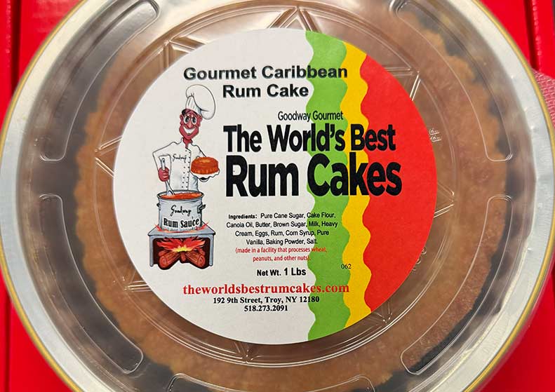 Gourmet Caribbean Rum Cake packaging with label on a red background