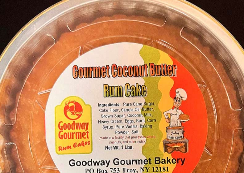 photo of coconut butter rum cake in tin pan with label