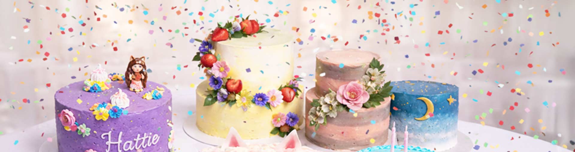 a collection of cakes with confetti falling