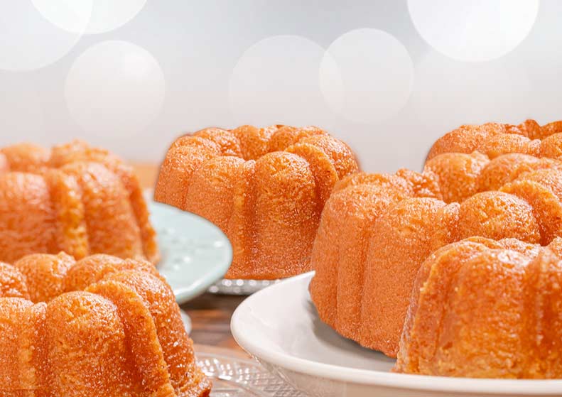 Bundt cakes on a white plate with a blurred background