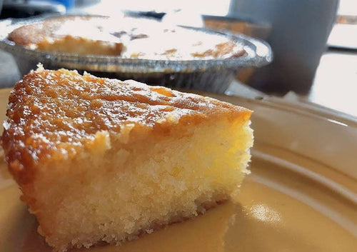 Slice of cake on a plate with a blurred background